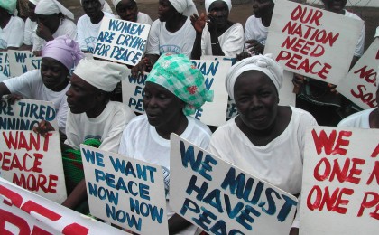 Liberian women demonstrate at the American Embassy in Monrovia at the height of the civil war, 2003